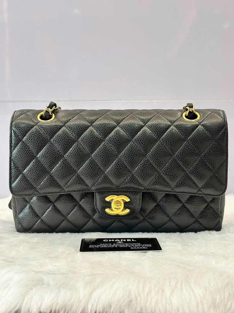 Authentic Chanel (Category: Luxury Bags & Wallets) located in Manila. Submitted by chloe_luxuries (Listing ID 1460277290, Image 1). Description: Guaranteed Original Chanel flap 25 caviar black Gold hardware series 31 Excellent condition Comes with complete inclusion with COA Pm for those interested .