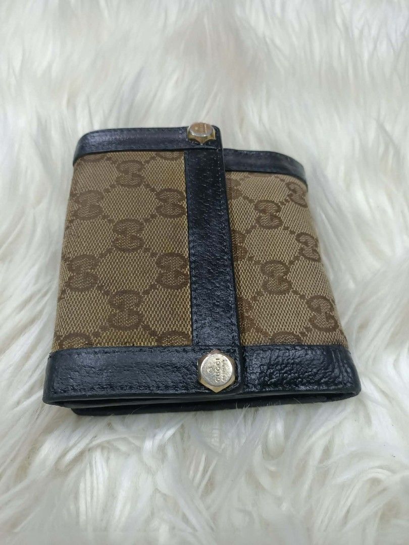 AUTHENTIC GUCCI CHARMY UNISEX TRIFOLD WALLET (Category: Luxury Bags & Wallets) located in Bayombong. Submitted by Gentlemans_ClosEt (Listing ID 1460171487, Image 1). Description: AUTHENTIC GUCCI CHARMY UNISEX TRIFOLD WALLET 💯% GUARANTEED AUTHENTIC/LEGIT JAPAN SURPLUS SOURCE NO LEATHER CRACKS NO RUBS ON THE CANVAS MINIMAL SIGN OF USAGE INSIDE THE WALLET RECOLOR LEATHER FOR PRESENTABLE LOOKS.