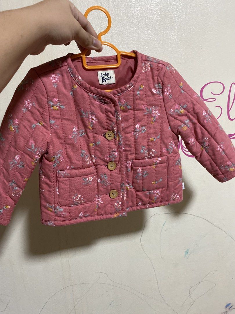 Baby Bush Quilted Floral Jacket (Category: Babies & Kids Fashion) located in Manila. Submitted by chingsenallertse (Listing ID 1460245870, Image 1). Description: - Adorable pink quilted jacket for babies - Features a charming floral print - Wooden button-down front closure - Two convenient pockets - Perfect for keeping little ones warm in cooler weather - Great for layering over other outfits.