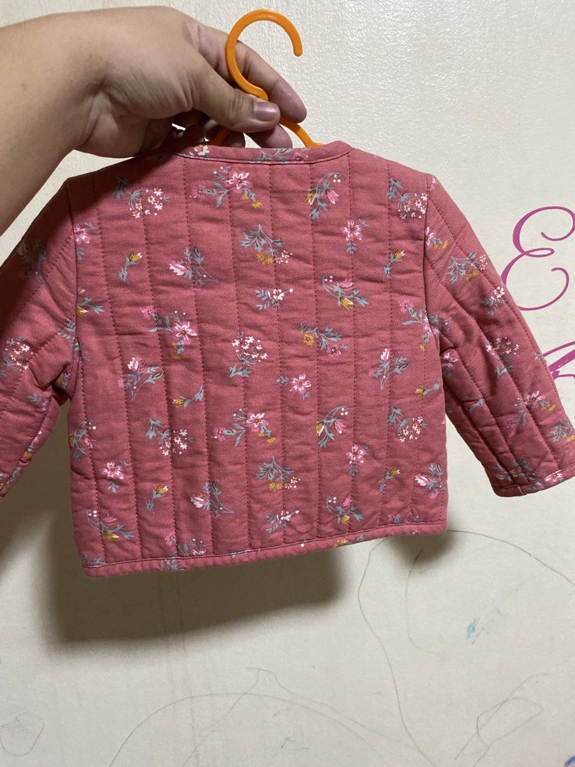 Baby Bush Quilted Floral Jacket (Category: Babies & Kids Fashion) located in Manila. Submitted by chingsenallertse (Listing ID 1460245870, Image 2). Description: - Adorable pink quilted jacket for babies - Features a charming floral print - Wooden button-down front closure - Two convenient pockets - Perfect for keeping little ones warm in cooler weather - Great for layering over other outfits.