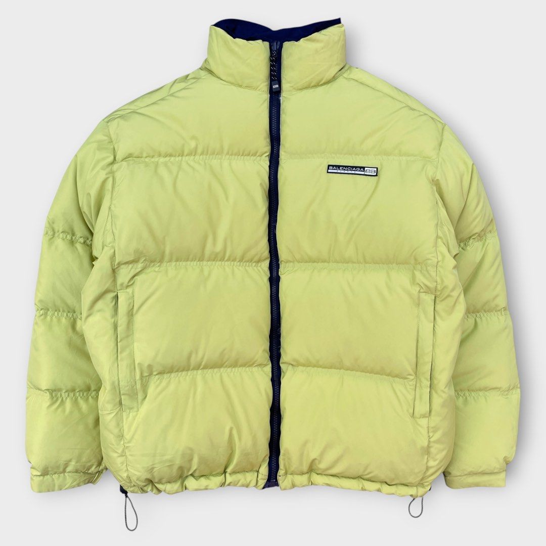 Balenciaga - Sports Reversible Down Puffer Jacket (Category: Coats, Jackets and Outerwear) located in Los Banos. Submitted by declutterking (Listing ID 1460135337, Image 2). Description: Size 3 on tag Expertly blending luxury and streetwear, this jacket offers versatile style for any occasion. With its reversible design, this jacket is perfect for both formal and casual settings. Neon green/navy colorway. Dimensions: 20.25" shoulders 25" chest 26