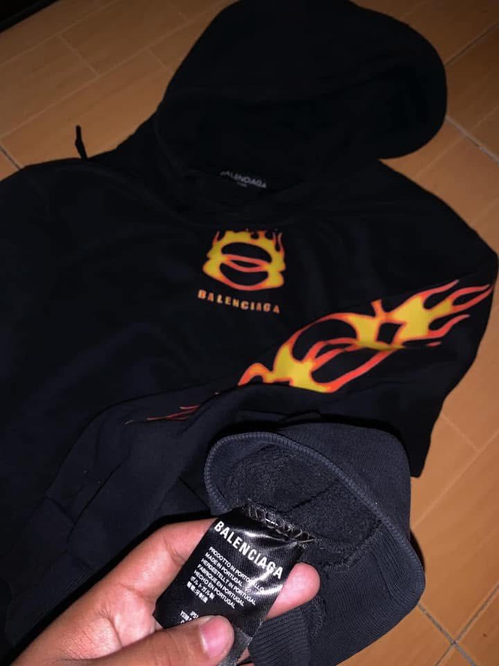 BALENCIAGA BURNING UNITY LOGO HOODIE (Category: Coats, Jackets and Outerwear) located in Caloocan City. Submitted by goodwills31 (Listing ID 1460150824, Image 3). Description: BALENCIAGA BURNING UNITY LOGO HOODIE LEGTH 27 WIDTH 24 CONDITION: EXCELLENT CONDITION COLOR RATE: 10/10 ISSUE: MINIMAL HOLE.