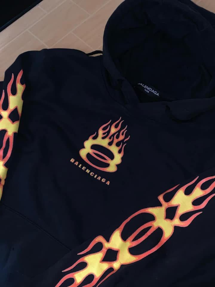 BALENCIAGA BURNING UNITY LOGO HOODIE (Category: Coats, Jackets and Outerwear) located in Caloocan City. Submitted by goodwills31 (Listing ID 1460150824, Image 2). Description: BALENCIAGA BURNING UNITY LOGO HOODIE LEGTH 27 WIDTH 24 CONDITION: EXCELLENT CONDITION COLOR RATE: 10/10 ISSUE: MINIMAL HOLE.