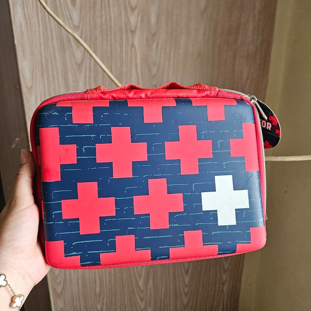 Band-Aid First Aid Kit bag with a geometric plus-sign pattern (Category: Medical Supplies & Tools) located in Digos. Submitted by marianfinds (Listing ID 1460173567, Image 1). Description: Authentic/preloved item. Actual photos posted. Please check all photos and details carefully before purchasing. Minor signs of use may be present. 📌Please manage your expectations this is not brandnew Walk in buyers are always welcome!✨️ 📍Location: Lim extens