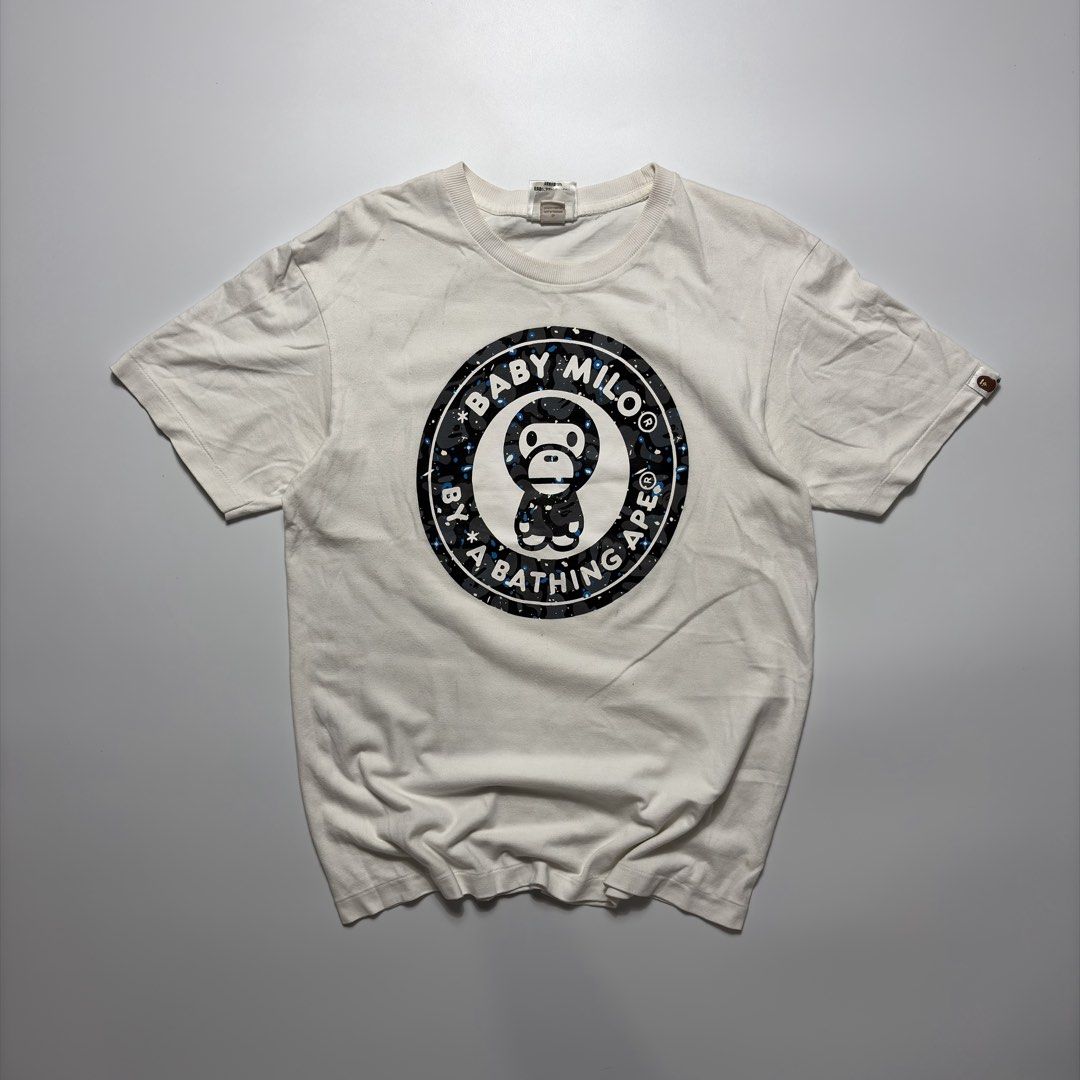 Bape x Baby Milo Tee (Category: Tshirts & Polo Shirts ) located in Makati City. Submitted by tulakngdamit.ph (Listing ID 1460276551, Image 1). Description: WTS! Bape x Baby Milo Tee Width: 18 Inches Length: 26 Inches Excellent.