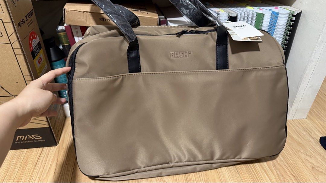 BASH Gateway Weekender Bag - Oak (Category: Shoulder Bags) located in Quezon City. Submitted by bundesal_ (Listing ID 1460303216, Image 2). Description: BASH Gateway Weekender Bag - Oak ₱1,800 Brand new/unused BASH Gateway Weekender in Oak. Never got to use it. Protective plastics are still intact on the handles and tags are still attached. Details: • Spacious 36.6L capacity • Waterproof nylon material • Padded laptop compartment (up to 14”) • La
