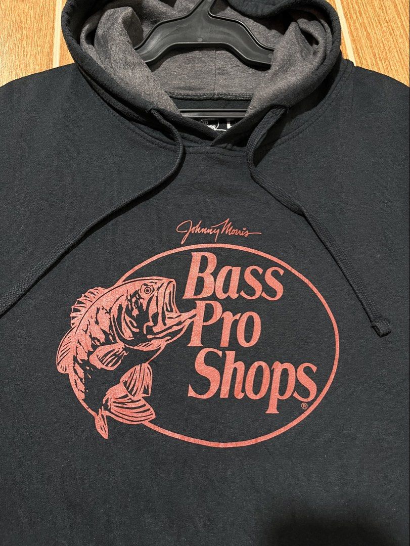 Bass Pro Shops pullover hoodie (Category: Hoodies) located in Lucena. Submitted by mjaothrift (Listing ID 1460299809, Image 3). Description: Bass Pro Shops pullover hoodie featuring a red fish logo and the Johnny Morris signature detail on the chest Size large on tag 24 x 27 inches .