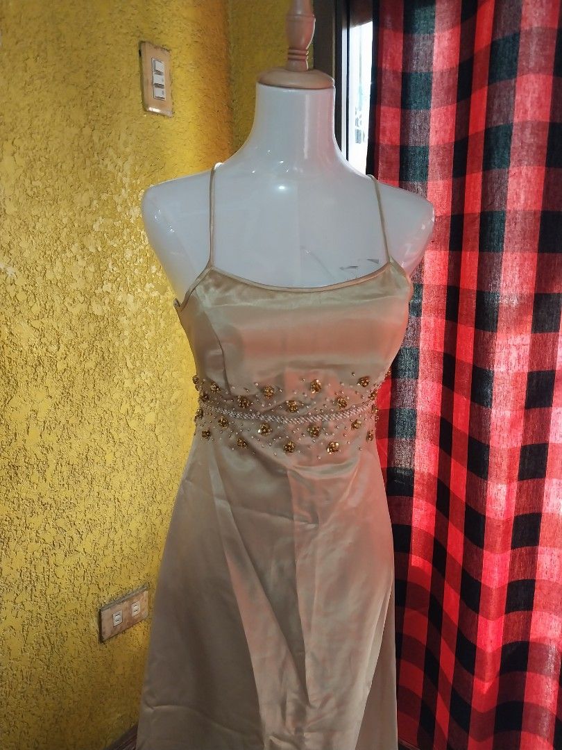 Beaded Champagne Evening Gown (Category: Evening dresses & gowns) located in Manila. Submitted by PrinceDani.Clothing (Listing ID 1460247147, Image 2). Description: - Stunning champagne colored evening gown - Intricate beadwork on the bodice - Luxurious satin sheen fabric - Beautifully drapes for a flattering silhouette - Ideal for formal events and special occasions Size 28in bust 28in waist 46in length excellent condition .