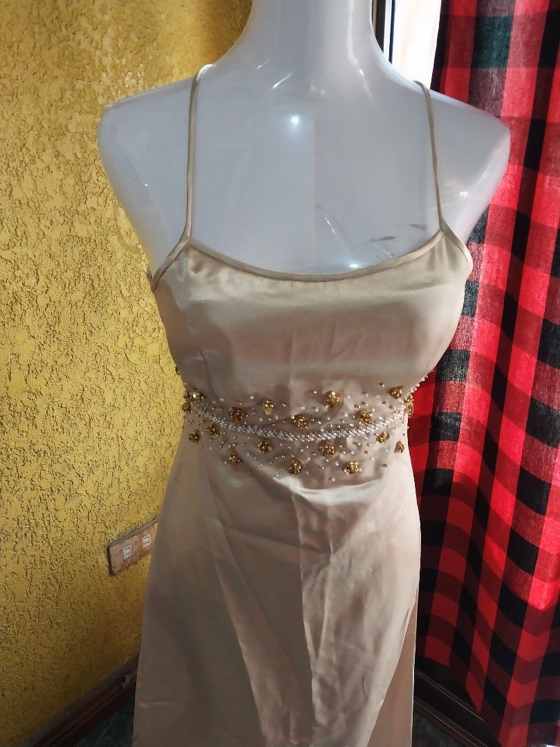Beaded Champagne Evening Gown (Category: Evening dresses & gowns) located in Manila. Submitted by PrinceDani.Clothing (Listing ID 1460247147, Image 3). Description: - Stunning champagne colored evening gown - Intricate beadwork on the bodice - Luxurious satin sheen fabric - Beautifully drapes for a flattering silhouette - Ideal for formal events and special occasions Size 28in bust 28in waist 46in length excellent condition .