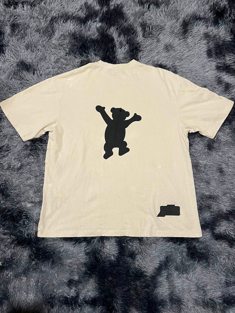 Bear Graphic T-Shirt (Category: Tshirts & Polo Shirts ) located in Manila. Submitted by vastriver-12e2c3 (Listing ID 1460286900, Image 2). Description: - Cream colored t-shirt - Features a black bear graphic on the front - Similar graphic on the back with a small logo detail - Comfortable fit for casual wear.