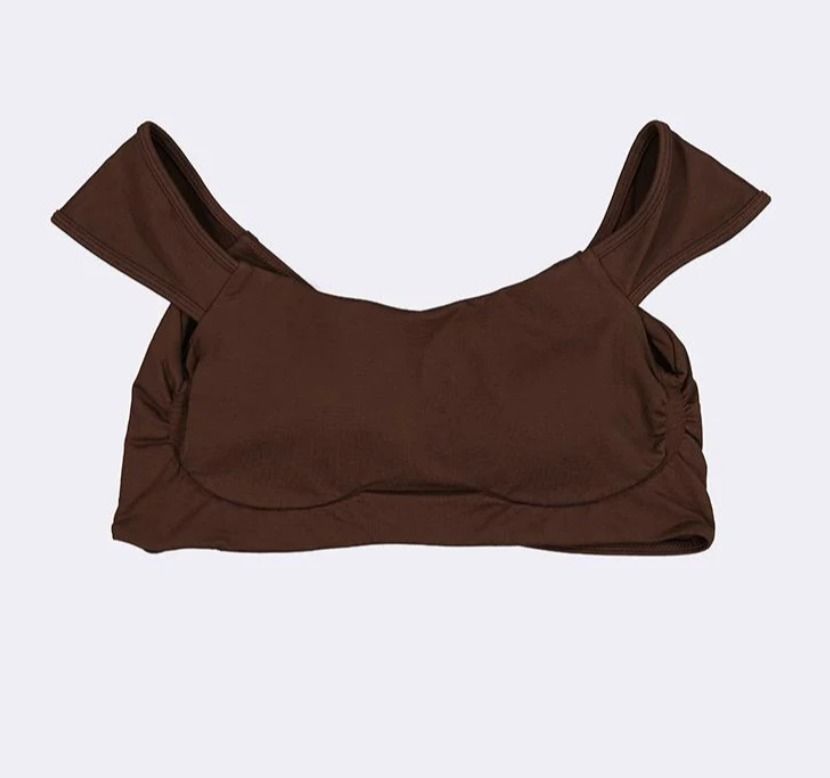 Bench Active Brown Sports Bra Size S (Category: Activewear) located in Butuan. Submitted by notcwp (Listing ID 1460236224, Image 3). Description: - Brand: Bench Active - Color: Brown - Size: Small (S) - Material: Polyamide and Elastane - Features: Removable padding - Condition: Brand new with original tag attached - Versatile: Ideal for workouts or casual wear.