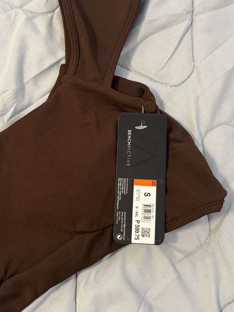 Bench Active Brown Sports Bra Size S (Category: Activewear) located in Butuan. Submitted by notcwp (Listing ID 1460236224, Image 2). Description: - Brand: Bench Active - Color: Brown - Size: Small (S) - Material: Polyamide and Elastane - Features: Removable padding - Condition: Brand new with original tag attached - Versatile: Ideal for workouts or casual wear.