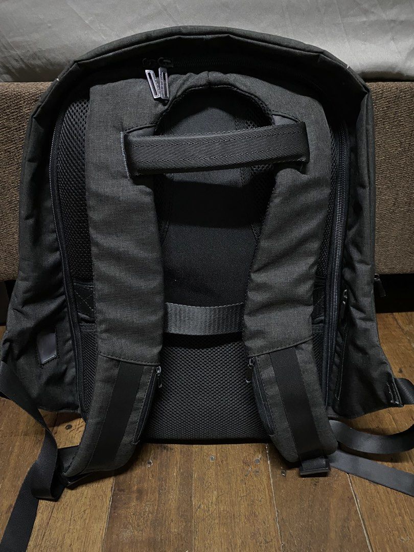 Black Backpack with Multiple Compartments (Category: Backpacks) located in Quezon City. Submitted by natesm (Listing ID 1460208561, Image 2). Description: - Stylish dark grey backpack - Front zip pocket and two side pockets for easy access - Multiple interior compartments for excellent organization - Padded straps and back for maximum comfort - Convenient side USB charging port (cable not included) - Ideal for daily commutes, school, or travel ad