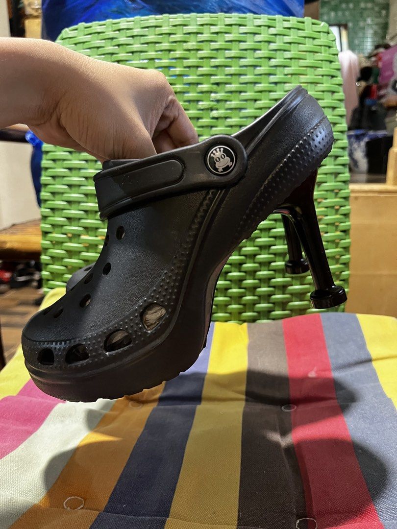 Black Crocs High Heel Platform Shoes (Category: Heels) located in Davao. Submitted by wornbycathy (Listing ID 1460300449, Image 2). Description: - Unique black Crocs design - Features a stylish high heel and platform - Perfect for making a statement and adding fun to outfits - Comfortable Crocs material - Ideal for parties or standing out.