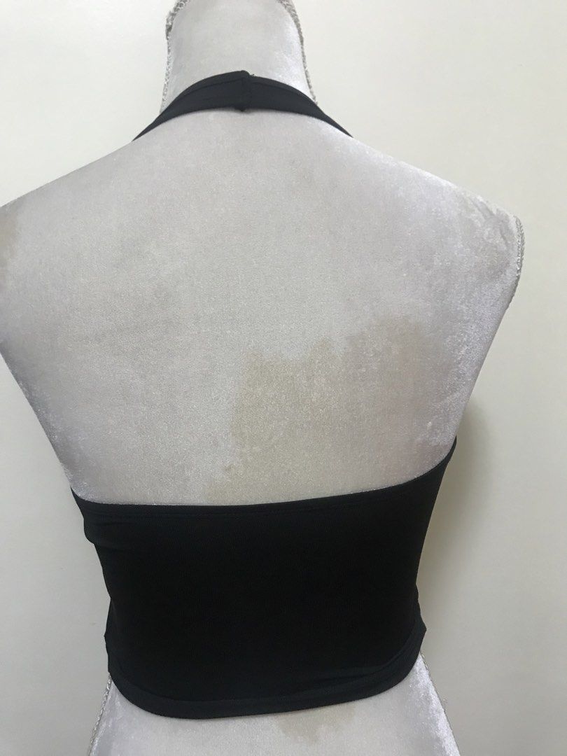 Black Halter Top with Silver Buckle Detail (Category: Sleeveless) located in Manila. Submitted by airamef28.closet (Listing ID 1460263224, Image 2). Description: - Black halter neck top - Unique front cut-out with silver metal buckle detail - Stretchy material for a comfortable fit - Simple band back - Ideal for going out or a night on the town.