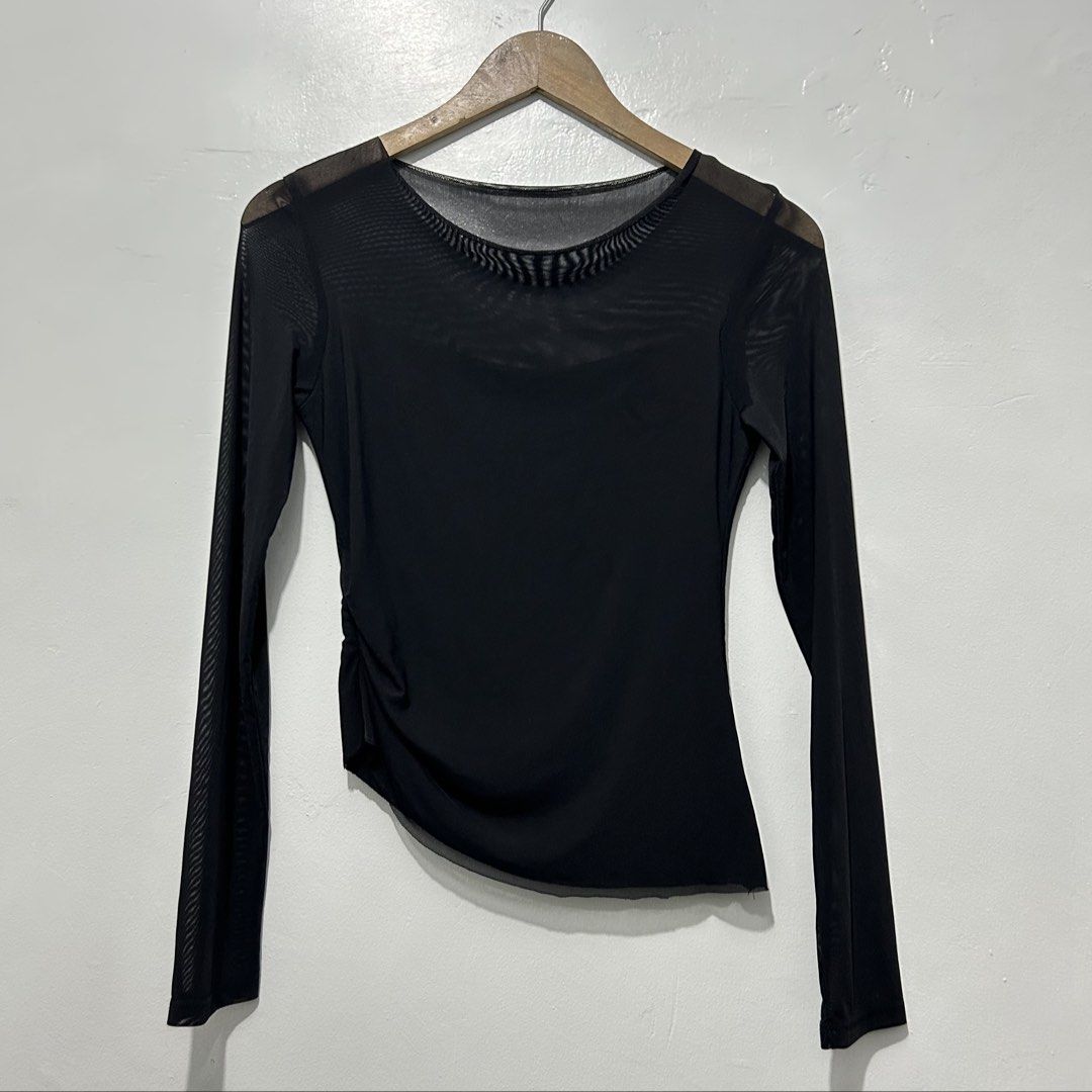 Black Mesh Sleeve Top (Small) (Category: Longsleeves) located in Caloocan City. Submitted by lulufanatics (Listing ID 1460246657, Image 1). Description: Black, long-sleeve sheer mesh top featuring a round neckline and asymmetric ruched detailing at the side. Small Loc: North Caloocan 📍 Can ship tru lalamove or j&t.