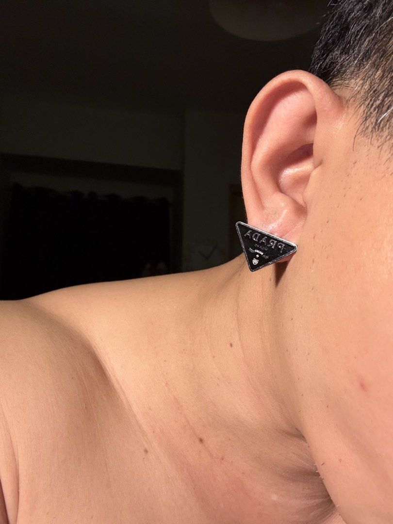 Black Prada Symbole Earrings (Category: Earrings) located in Mandaluyong City. Submitted by material_boi (Listing ID 1460291210, Image 3). Description: Super nice. Rare. May bigat, not ampaw. Stainless steel. The engraving is so nice and you can touch it. Bought this years ago kasi nagandahan ako. Perfect if you want to look chic. Maganda rin to na isa lang yung suot nyo. No issues, maybe just signs of use which is normal. Yung isang pakaw may no