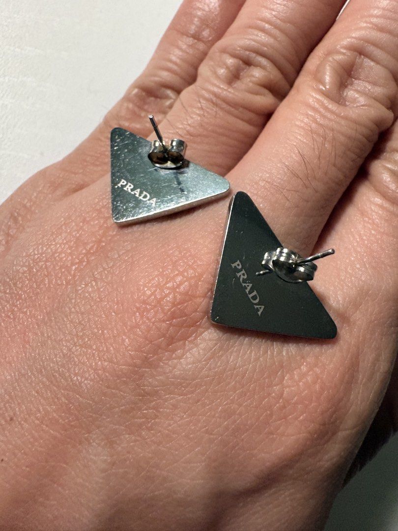 Black Prada Symbole Earrings (Category: Earrings) located in Mandaluyong City. Submitted by material_boi (Listing ID 1460291210, Image 2). Description: Super nice. Rare. May bigat, not ampaw. Stainless steel. The engraving is so nice and you can touch it. Bought this years ago kasi nagandahan ako. Perfect if you want to look chic. Maganda rin to na isa lang yung suot nyo. No issues, maybe just signs of use which is normal. Yung isang pakaw may no