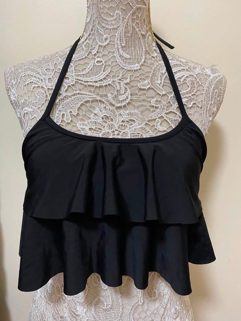 Black Ruffled Halterneck Bikini Top (Category: Bikinis & Swimsuits) located in Manila. Submitted by airamef28.closet (Listing ID 1460264081, Image 1). Description: - Cute black bikini top - Flattering tiered ruffle design - Halterneck style - Tie-back closure - Ideal for beach or pool days - Comfortable and stylish.