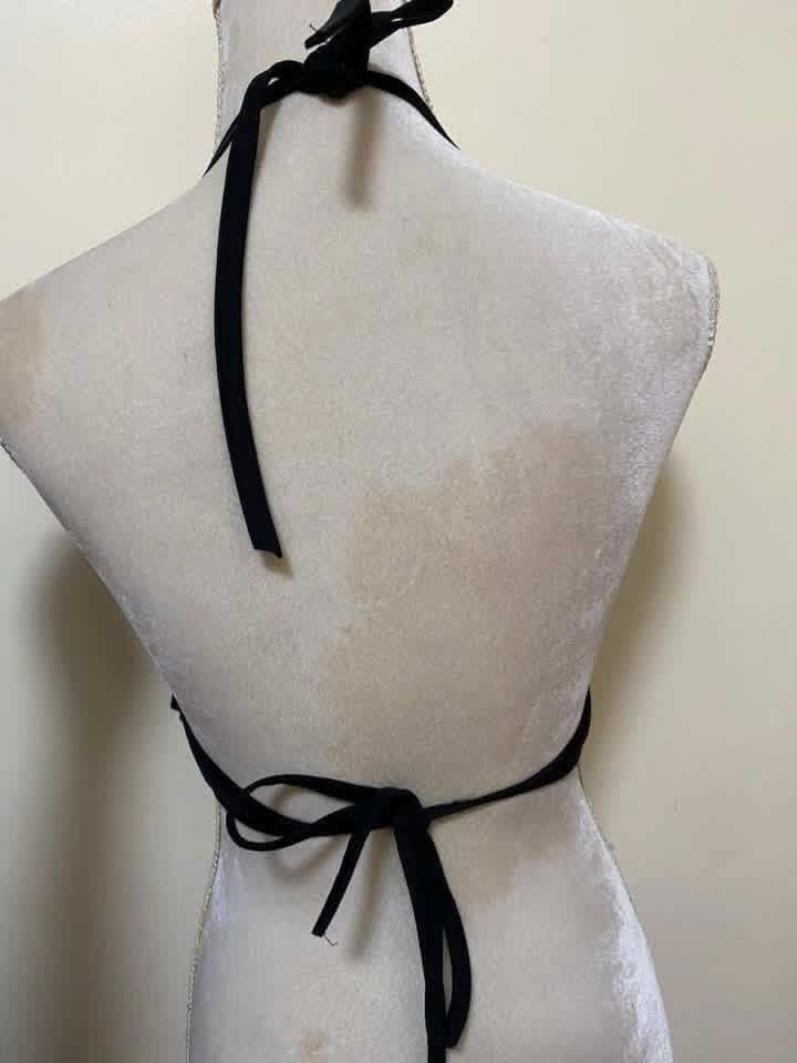 Black Ruffled Halterneck Bikini Top (Category: Bikinis & Swimsuits) located in Manila. Submitted by airamef28.closet (Listing ID 1460264081, Image 2). Description: - Cute black bikini top - Flattering tiered ruffle design - Halterneck style - Tie-back closure - Ideal for beach or pool days - Comfortable and stylish.