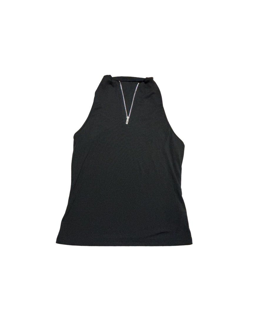 Black sleeveless mock neck zip tank top (Category: Sleeveless) located in Manila. Submitted by skylurker.star (Listing ID 1460162271, Image 1). Description: - Black sleeveless tank top - Mock neck with silver front zipper - Ribbed fabric texture - Versatile for layering or standalone wear.