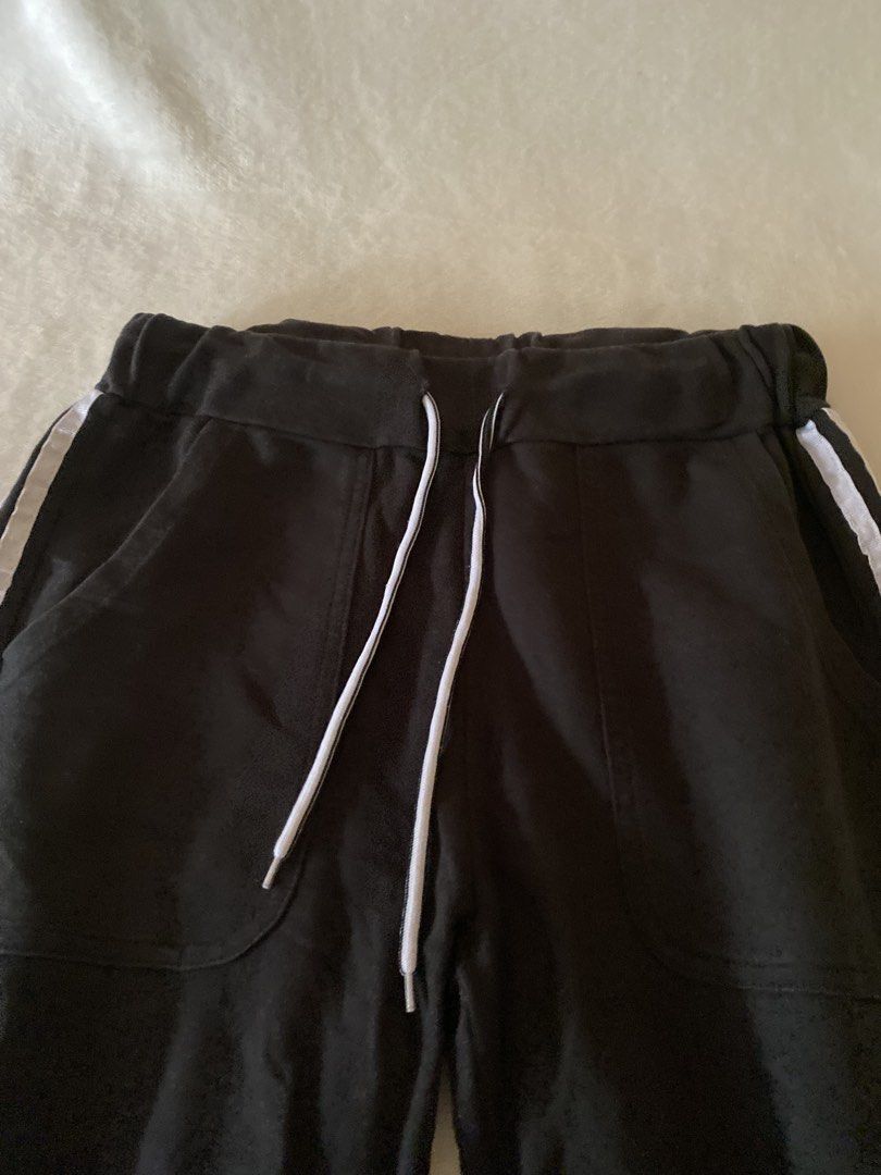 Black Track Pants with White Side Stripe - Size XL (Category: Other Bottoms) located in Batangas. Submitted by v.ukay (Listing ID 1460133908, Image 2). Description: - Black track pants - White stripes down the sides - Elastic waistband with drawstring - Two side pockets - Size XL but this was my S-sized sister - Ideal for casual wear or lounging.