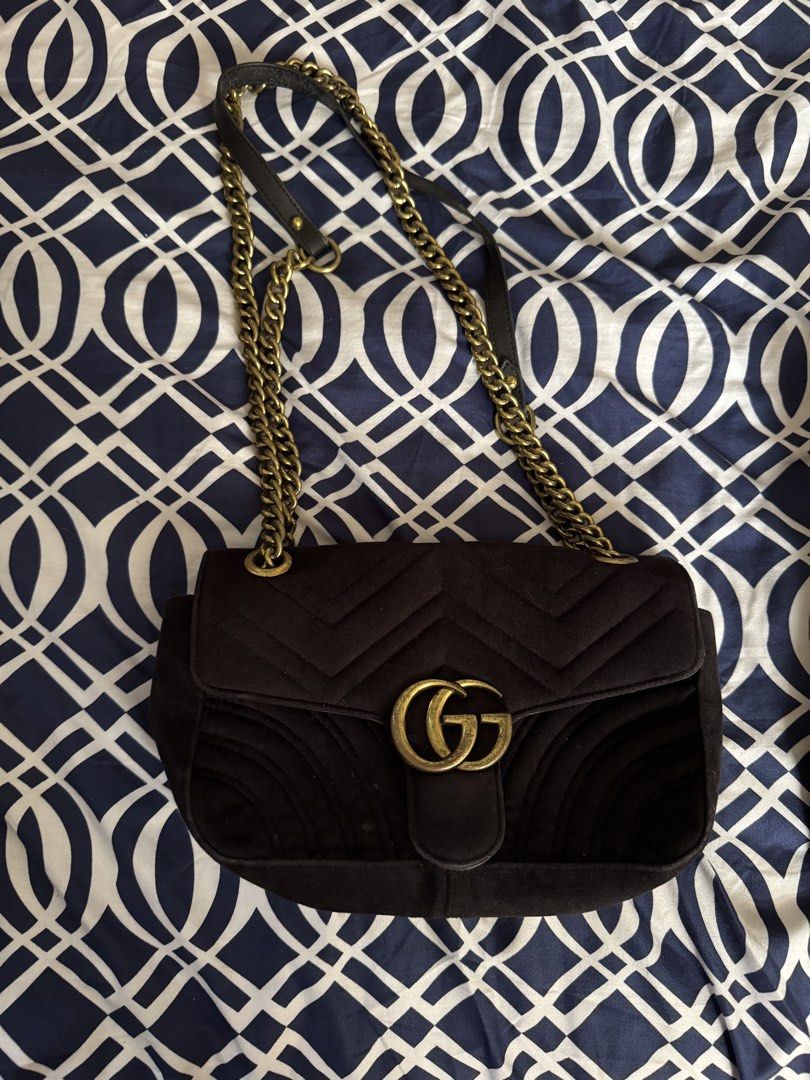 Black Velvet Shoulder Bag (Category: Shoulder Bags) located in Legazpi City. Submitted by grechaganda (Listing ID 1460163844, Image 1). Description: - black velvet shoulder bag - Features iconic GG logo hardware - Stylish quilted chevron pattern on the front - Adorable heart detail on the back - Elegant gold chain strap with comfortable leather shoulder pad - Ideal for nights out or elevating any outfit - Approximate dimensions: 9 inches wide x 6