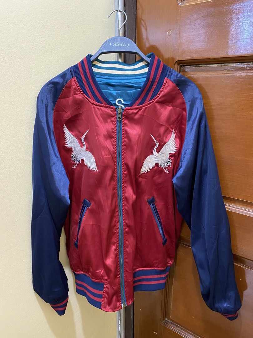 Bpcool Reversible Bomber Jacket US Navy & Crane Design (Category: Coats, Jackets and Outerwear) located in Manila. Submitted by haveago0dthrift (Listing ID 1460138022, Image 3). Description: - Reversible bomber jacket by Bpcool - Union Made - 1972 - Side 1: US Navy Seabees design with American flag and bee graphic - Side 2: Red base with two cranes and sun graphic - Features ribbed cuffs, collar, and hem - Zipper closure - Width 21 - Length 24.