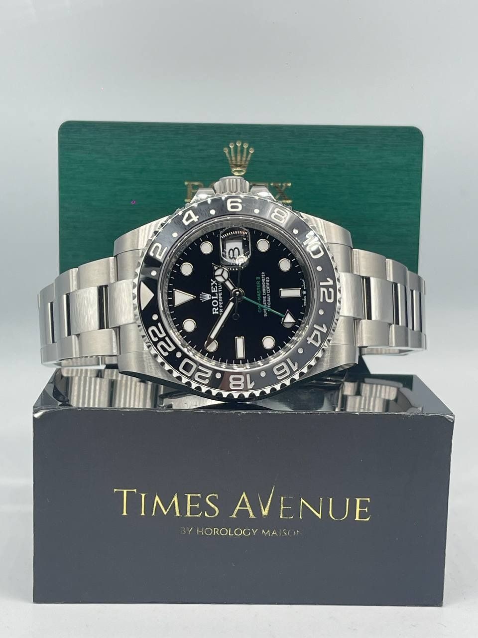Brand New 2026 Aug Rolex GMT Master 2 Stainless Steel 126710GRNR Oyster "Bruce Wayne" (Category: Watches) located in Singapore. Submitted by timesavenuesg (Listing ID 1460154084, Image 1). Description: **Wooden Card** Brand: Rolex Model number: 126710GRNR Dial Color: Black Condition: Brand New Unworn Case size: 40mm Case material: Oyster Stainless Steel Movement Type: Automatic Movement: Calibre 3285 Clasp: Folding Oysterlock safety clasp with Ea
