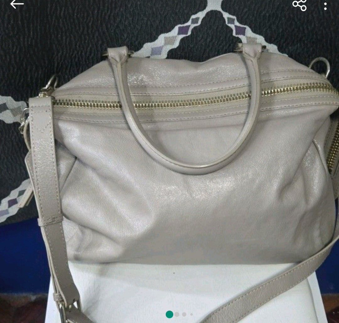 Breal Taupe Leather Bag (Category: Luxury Bags & Wallets) located in Manila. Submitted by affordabags_cd (Listing ID 1460226344, Image 1). Description: - Brand: Breal - Color: Taupe - Material: Leather - Features: Top handles, detachable shoulder strap - Exterior: Two zippered front compartments, metal studs on the bottom - Interior: Clean - Style: Great everyday bag.