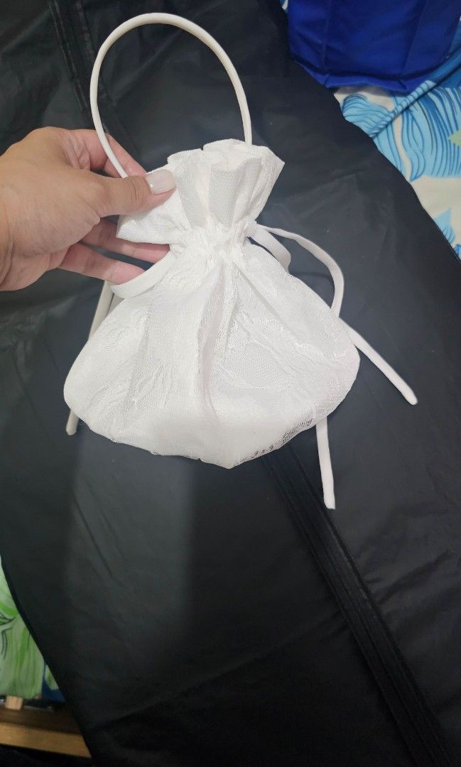 Bride Bag White Lace Pouch with handle (Category: Purses & Pouches) located in Paranaque City. Submitted by kochhhh (Listing ID 1460127928, Image 2). Description: - used bride bag for money envelopes etc - handheld fan not included, for size reference only. Cute white lace pouch with drawstring and handle..