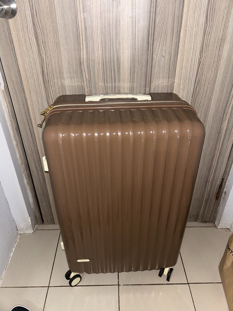 Brown Hardcase Luggage with Wheels (Category: Luggage) located in Quezon City. Submitted by chastnavarrete (Listing ID 1460267254, Image 1). Description: - Sturdy brown hardcase luggage - Smooth-rolling wheels for easy transport - With coffee holder - RFS: Wrong size.