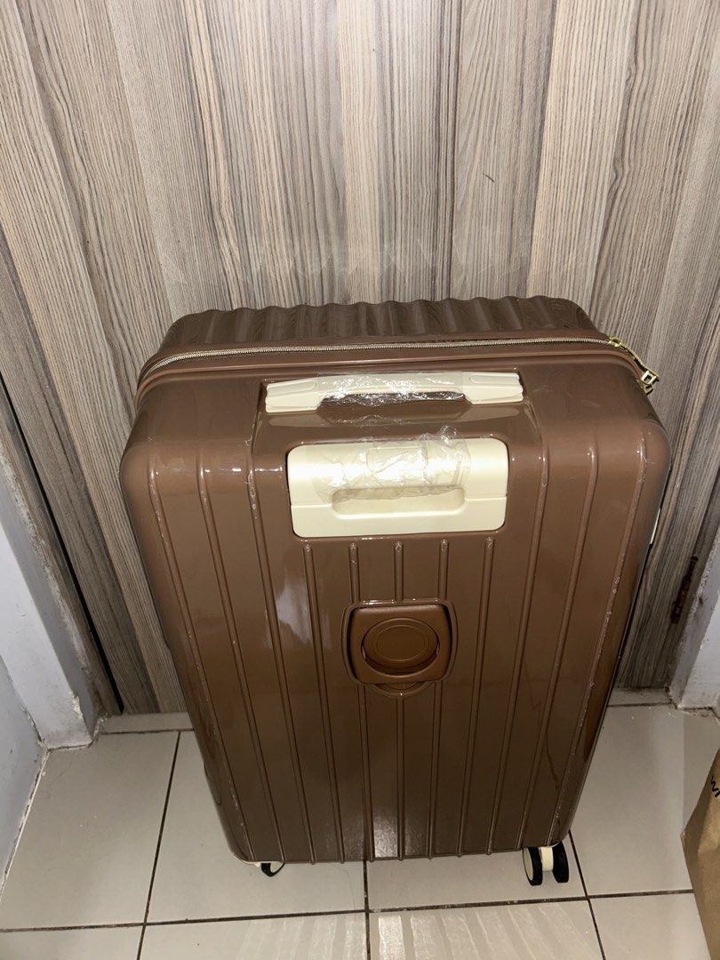 Brown Hardcase Luggage with Wheels (Category: Luggage) located in Quezon City. Submitted by chastnavarrete (Listing ID 1460267254, Image 2). Description: - Sturdy brown hardcase luggage - Smooth-rolling wheels for easy transport - With coffee holder - RFS: Wrong size.