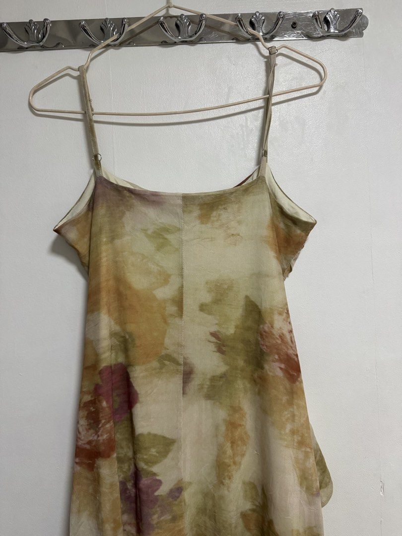 Brown Tie-Front Midi Dress Size (Category: Dresses) located in Manila. Submitted by frenchmacaron (Listing ID 1460170738, Image 3). Description: - AS Flores Fashion Collection Midi Dress - Size: Medium (M) - Unique tie-front detail - Ruffled hemline - Adjustable spaghetti straps - All-over abstract floral print in earthy tones - Versatile: suitable for casual outings or special events.