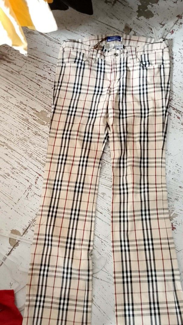 Burberry Blue Label Plaid Flare Pants (Category: Luxury Apparel) located in Iloilo. Submitted by janillthrifted (Listing ID 1460149954, Image 1). Description: - Authentic Burberry Blue Label - Classic plaid pattern on beige base - Flare leg style - Button and zip closure - Size 38 - Ideal for a stylish casual look.