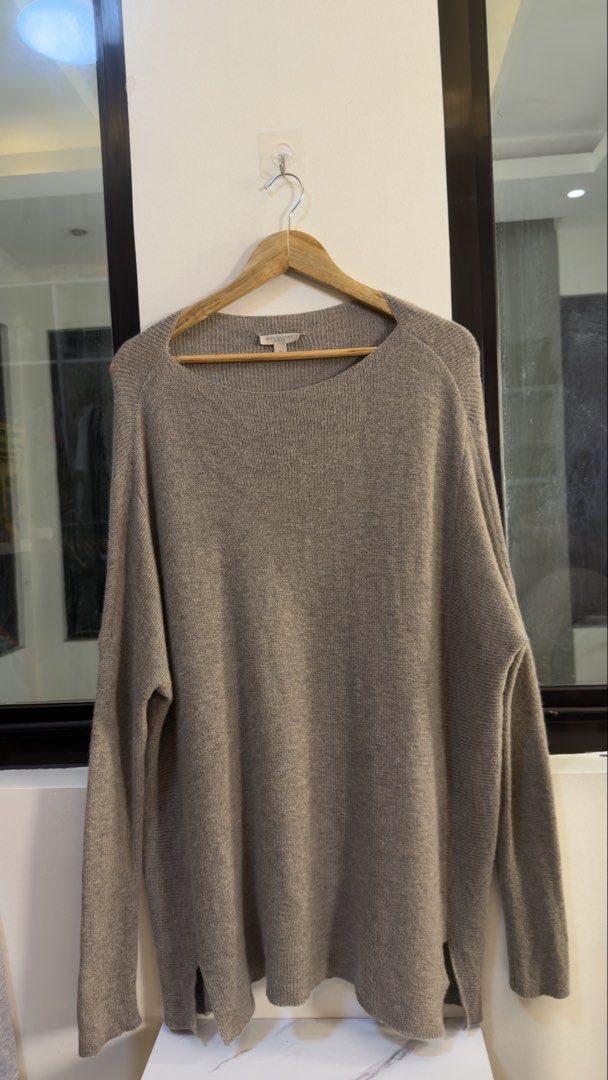 Burberry Brit Knit Sweater Size M (Category: Coats, Jackets and Outerwear) located in Paranaque City. Submitted by mykapoynton (Listing ID 1460295313, Image 2). Description: Burberry Brit Knit Sweater Size M - Color: Taupe - Size: Medium (M) - Material: 80% Wool, 20% Cashmere blend - Origin: Made in Thailand - Style: Long sleeves, relaxed fit, boat neckline - Features: Side slits for a modern touch - Versatile: Ideal for layering or wearing solo.