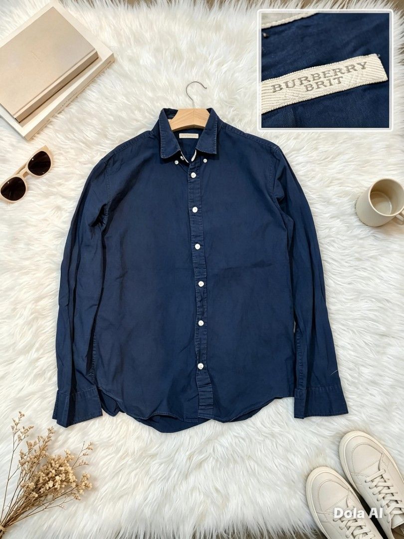 Burberry Brit Navy Blue Button Down Shirt (Category: Tshirts & Polo Shirts ) located in Manila. Submitted by momofunodos (Listing ID 1460198682, Image 1). Description: ALL ITEMS ARE PRE-LOVED ✅Bale source. ✅Ukay thrifted. ✅Manage your expectations these are ukay.( dont expect crispy as new) ✅ Colors may different in person due to camera lens and lights. ✅ There's a sign of usage in every item ✅ Small stain washable stain are normal in ukay we do 