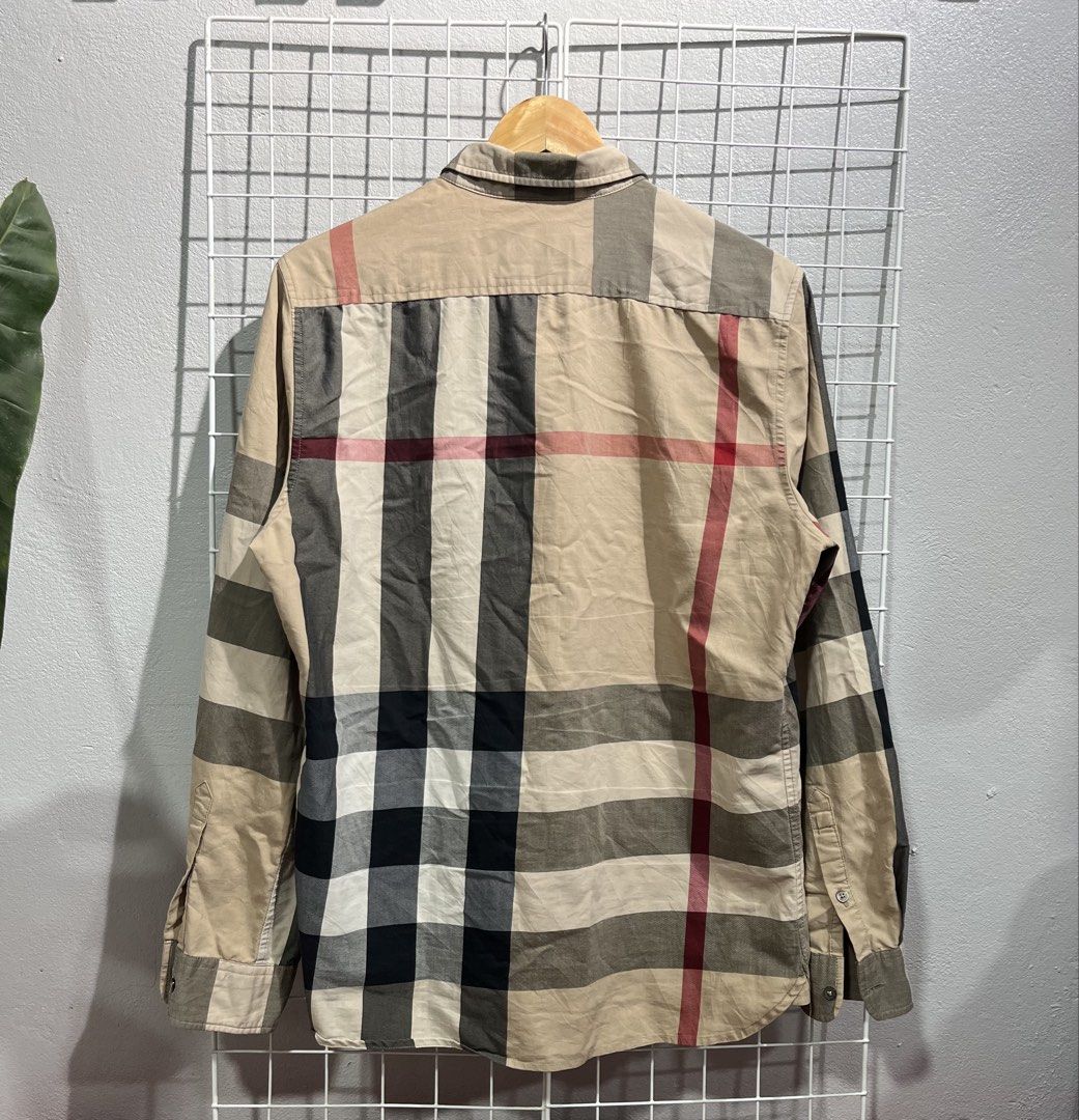 Burberry Check Poplin Long Sleeve Polo (Category: Luxury Apparel) located in Tuguegarao City. Submitted by preowned_curation (Listing ID 1460207165, Image 2). Description: Front Length: 26, Back Length: 28 x 21.5 Fits Large Flaw: Loose stitch side armpit lining Still presentable to wear 800 Free ship!.