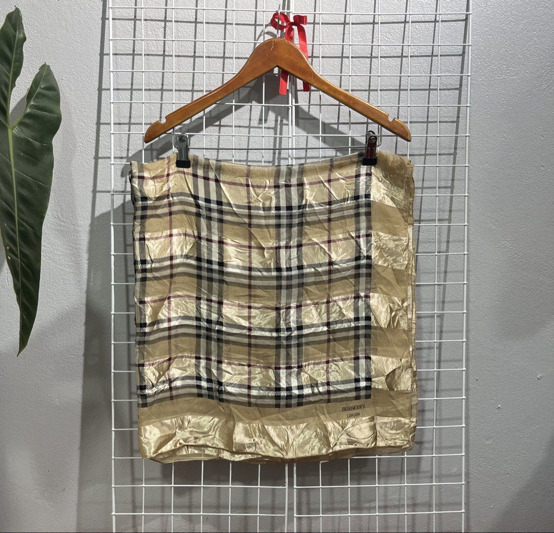 Burberry Check Silk Scarf (Category: Luxury Accessories) located in Tuguegarao City. Submitted by preowned_curation (Listing ID 1460128391, Image 2). Description: Classic plaid pattern interwoven with shimmering gold stripes. Length: 40” x Width: 37.5” Has minor dirt, needs light wash 700 + SF.