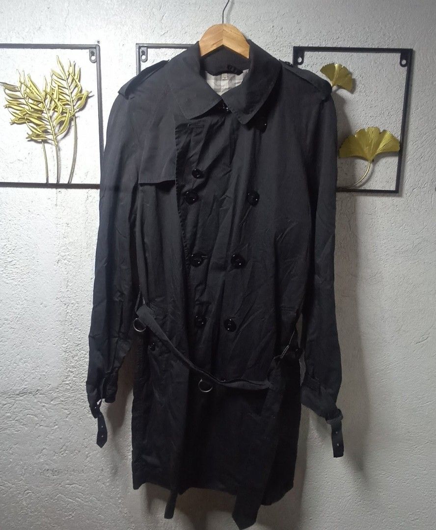 Burberry Double Breasted Trench Coat Size M (Category: Coats, Jackets and Outerwear) located in Kawit. Submitted by deidzdzn (Listing ID 1460205865, Image 3). Description: - Classic Burberry trench coat - Color: Dark Gray - Style: Double-breasted - Features: Belted waist with buckle - Size: M - Measurements: Width 21 inches, Length 37 inches - Interior: Iconic Burberry check lining - Perfect for layering.