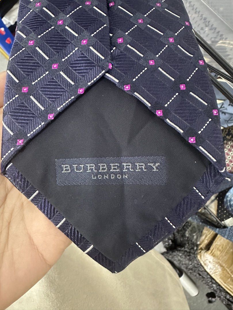 Burberry London Silk Tie (Category: Ties) located in Manila. Submitted by declutterpromax (Listing ID 1460200627, Image 2). Description: - Burberry Silk Tie - Iconic Nova Check Pattern with Pink Accents - Material: 100% Silk - Perfect for Formal or Business Casual Attire - Adds a Luxurious Touch to Any Outfit.