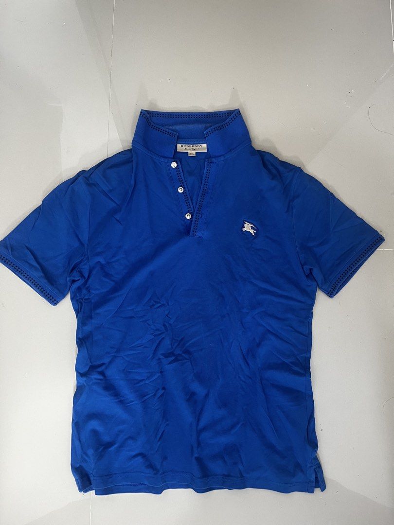 Burberry polo shirt (Category: Luxury Apparel) located in Cuartero. Submitted by johnmichae74239 (Listing ID 1460118838, Image 1). Description: medium to large yung fittings nya even though XXL on tag No issue As new.