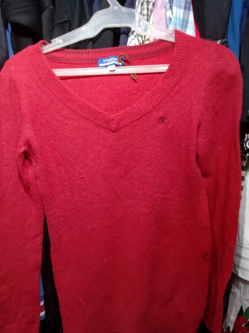Burberry Red V-Neck Knit Sweater (Category: Luxury Apparel) located in Iloilo. Submitted by janillthrifted (Listing ID 1460150135, Image 1). Description: - Authentic Burberry Red V-neck Knit Sweater - Size: Tagged 38 - Design: V-neck, long sleeves - Branding: Subtle Burberry logo on front, prominent logo on back - Material: Soft knit fabric - Versatile: Ideal for layering or wearing as a standalone piece.