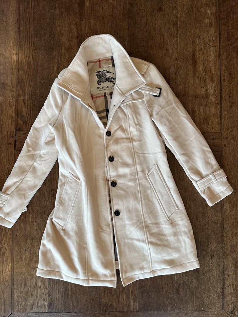 Burberry White Trench Coat (Category: Coats, Jackets and Outerwear) located in Silang. Submitted by ws.thrift (Listing ID 1460141924, Image 1). Description: Burberry White Trench Coat Size and Dimensions ⬇️ Size Tag: UK 8 / US 6 Condition: 8/10 Color rate: 8/10 Issue(s): Some visible discoloration/staining and small marks on the front Price: 4,999 PLEASE READ BEFORE ORDERING • COLOR MAY VARY DUE TO LIGHTING • PAYMENT FIRST — NO COD • LALAMOVE AND