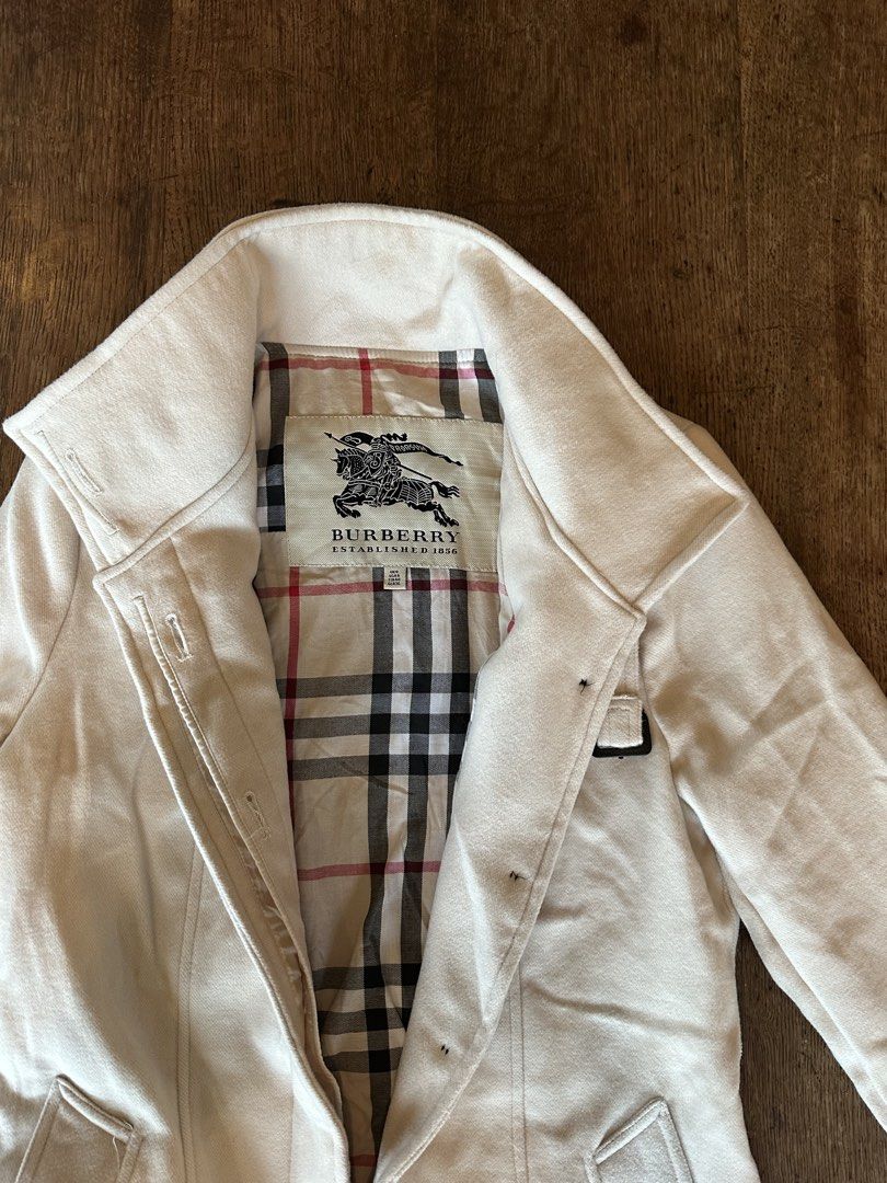Burberry White Trench Coat (Category: Coats, Jackets and Outerwear) located in Silang. Submitted by ws.thrift (Listing ID 1460141924, Image 2). Description: Burberry White Trench Coat Size and Dimensions ⬇️ Size Tag: UK 8 / US 6 Condition: 8/10 Color rate: 8/10 Issue(s): Some visible discoloration/staining and small marks on the front Price: 4,999 PLEASE READ BEFORE ORDERING • COLOR MAY VARY DUE TO LIGHTING • PAYMENT FIRST — NO COD • LALAMOVE AND