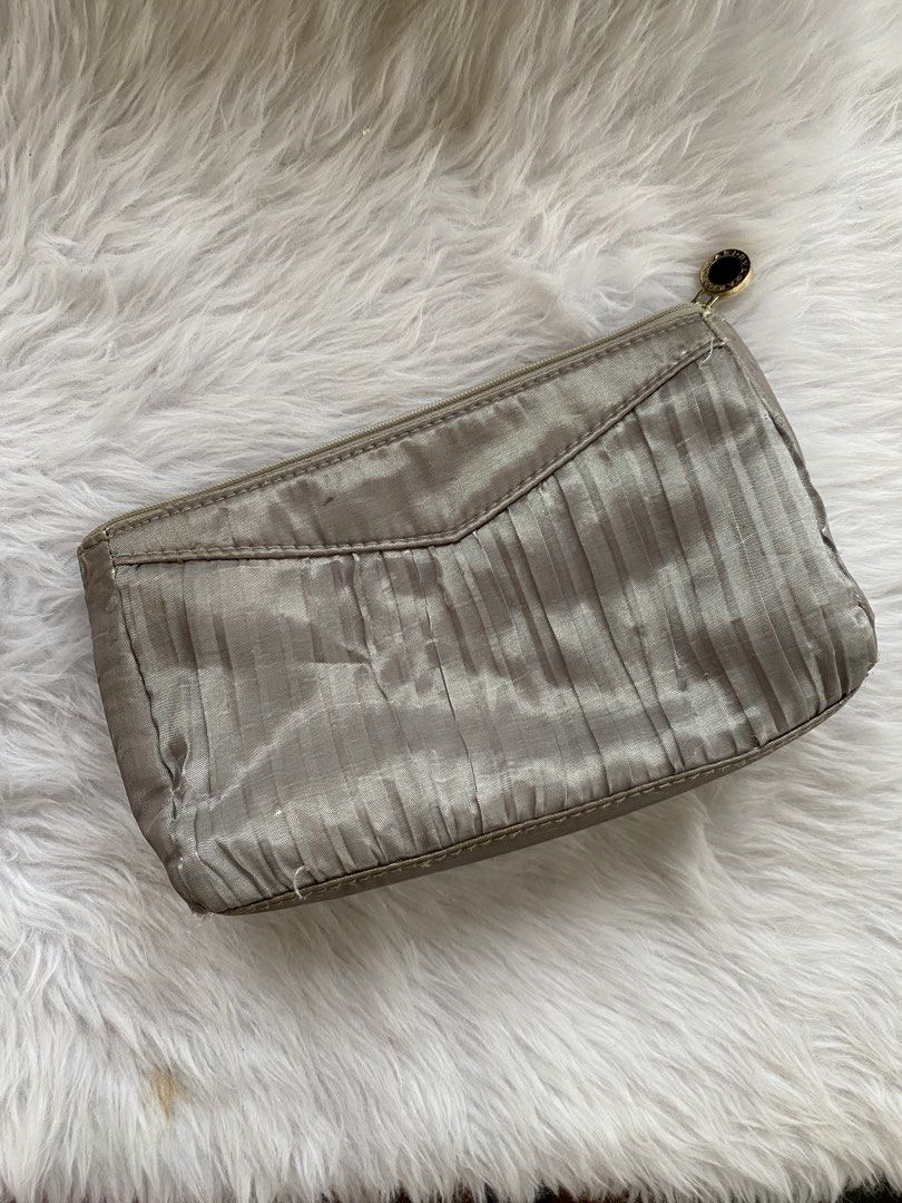 Bvlgari x Emirates Parfum Pouch Makeup Bag (Category: Purses & Pouches) located in Batangas. Submitted by v.ukay (Listing ID 1460166458, Image 2). Description: - Bvlgari Parfums grey pleated pouch - Exclusive collaboration with Emirates - Zipper closure with branded charm - Interior lining features repeating Bvlgari branding - Note: Some marks present inside the pouch - Ideal for travel or organizing small essentials.