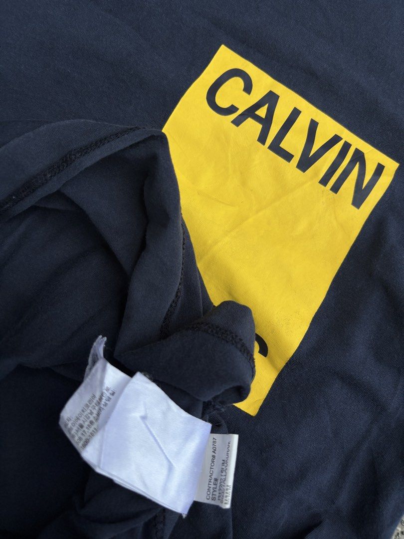 Calvin Klein Jeans Tee (Category: Tshirts & Polo Shirts ) located in Panabo. Submitted by thrifty.red (Listing ID 1460142529, Image 3). Description: 19x27 see last pic no hole loose stitch only.