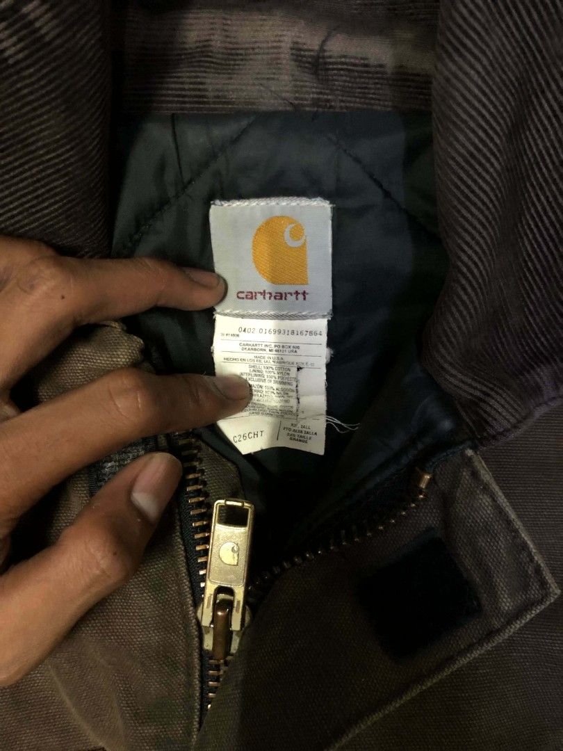 Carhartt Brown Canvas Work Jacket (Category: Coats, Jackets and Outerwear) located in Manila. Submitted by rheyrhey2323 (Listing ID 1460201052, Image 3). Description: - Classic Carhartt work jacket - Durable brown canvas material - Multiple front pockets - Zipper closure with snap button storm flap - Collar can be worn up or down - Ideal for work or casual wear.