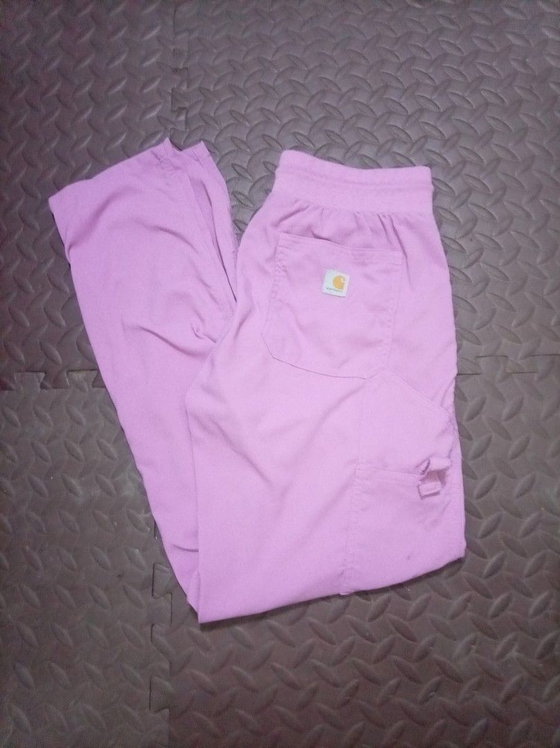 Carhartt Scrub Pants Lilac (Category: Other Bottoms) located in San Jose del Monte. Submitted by thegoodthrifts. (Listing ID 1460195503, Image 1). Description: - Brand: Carhartt - Color: Lilac - Style: Scrub Pants - Features: Drawstring waist, multiple pockets, side cargo pocket - Benefits: Comfortable, durable, suitable for work or lounging.