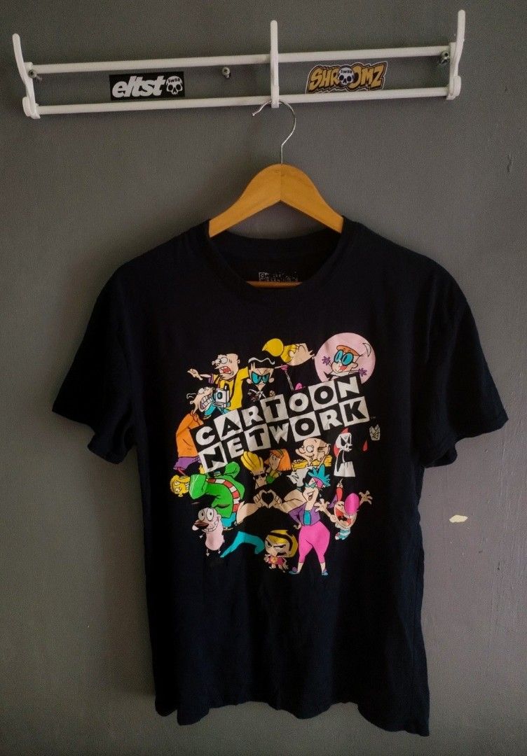 Cartoon Network T-Shirt - All Over Print (Category: Tshirts & Polo Shirts ) located in Naga. Submitted by basejohnpa64527 (Listing ID 1460122382, Image 1). Description: - Black t-shirt with fun Cartoon Network graphic print - Features characters from various classic shows - Made from a comfortable cotton-polyester blend - Size: Medium (M) - Ideal for fans of nostalgic cartoons.